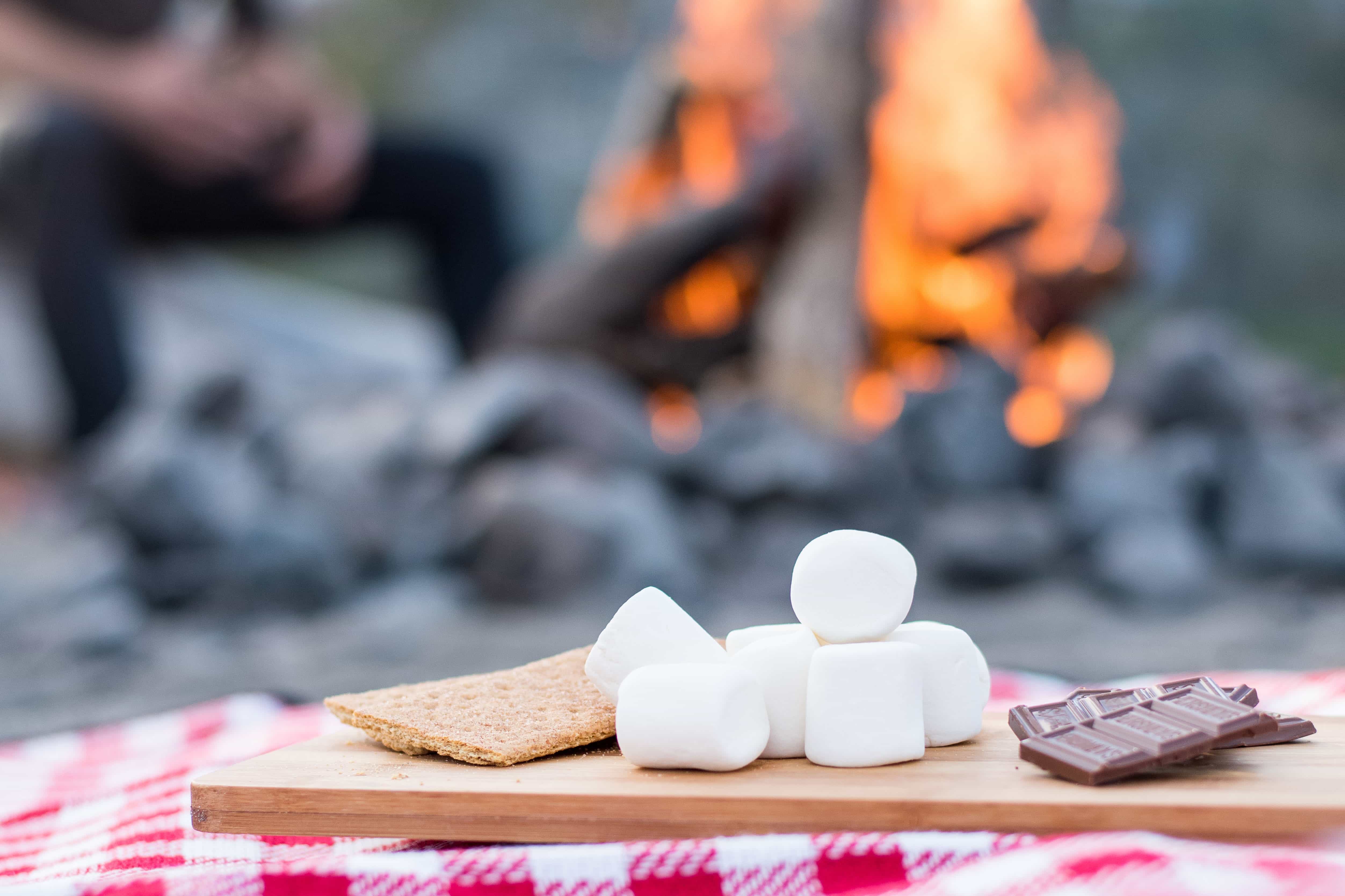 Preparing your perfect campfire smore.