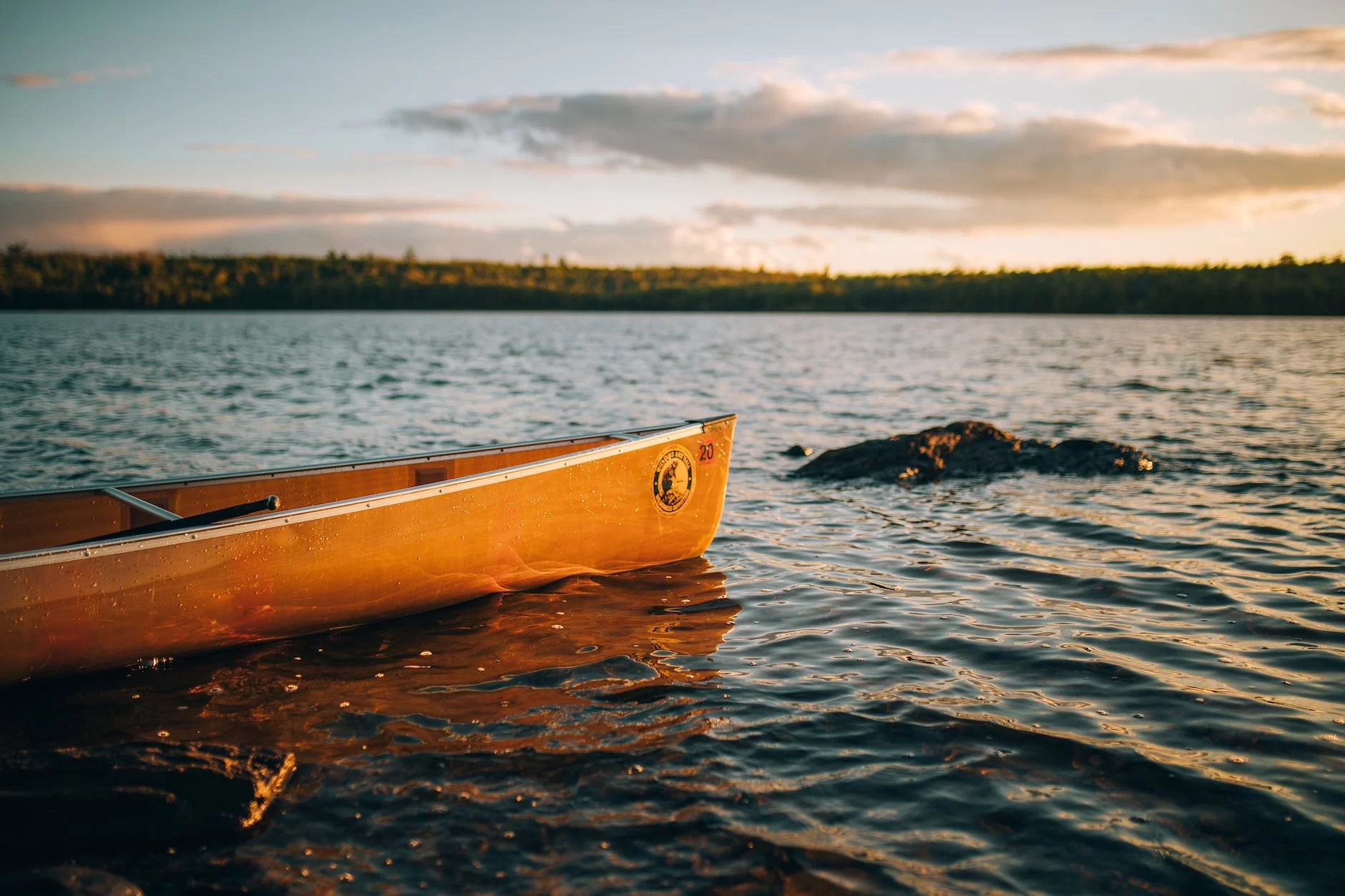 yellow canoe on body of water The best Resorts in Minnesota